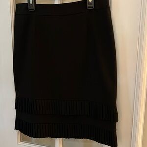 Black Alfani skirt w/pleats; 6P; Waist 27-28; Hips 35-36; Length 21